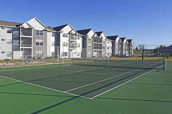 Outdoor tennis court at Cypress Court Apartments.